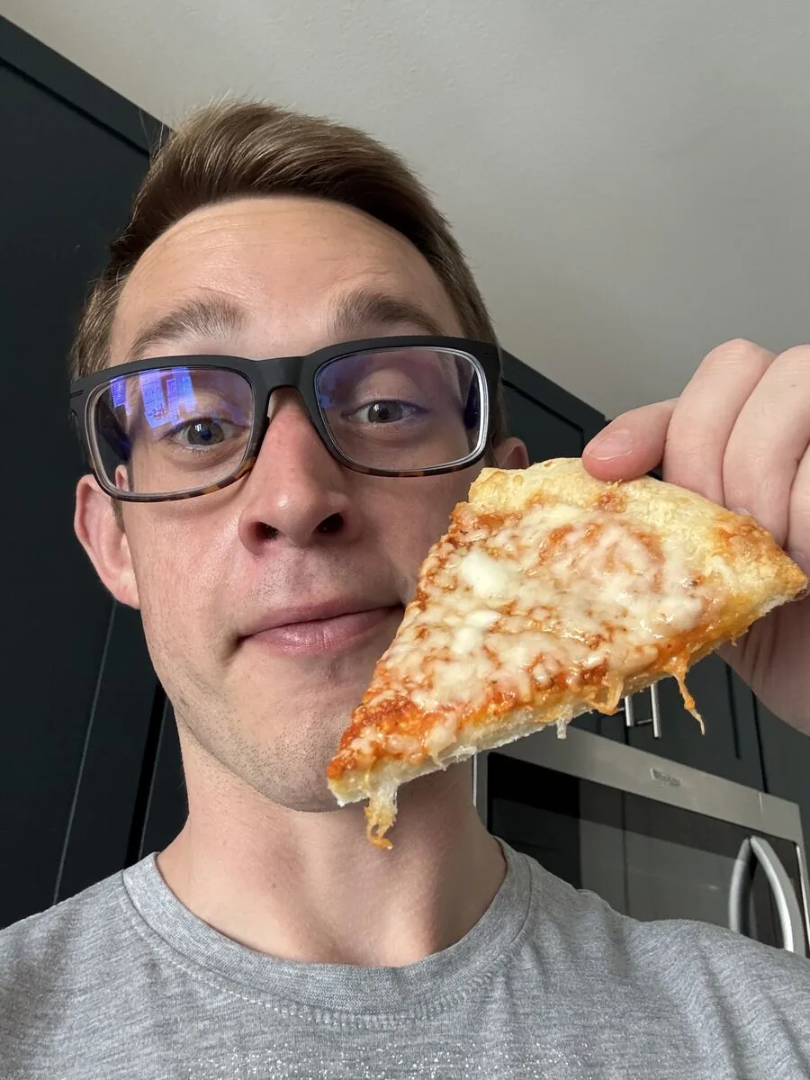 Josh eating pizza